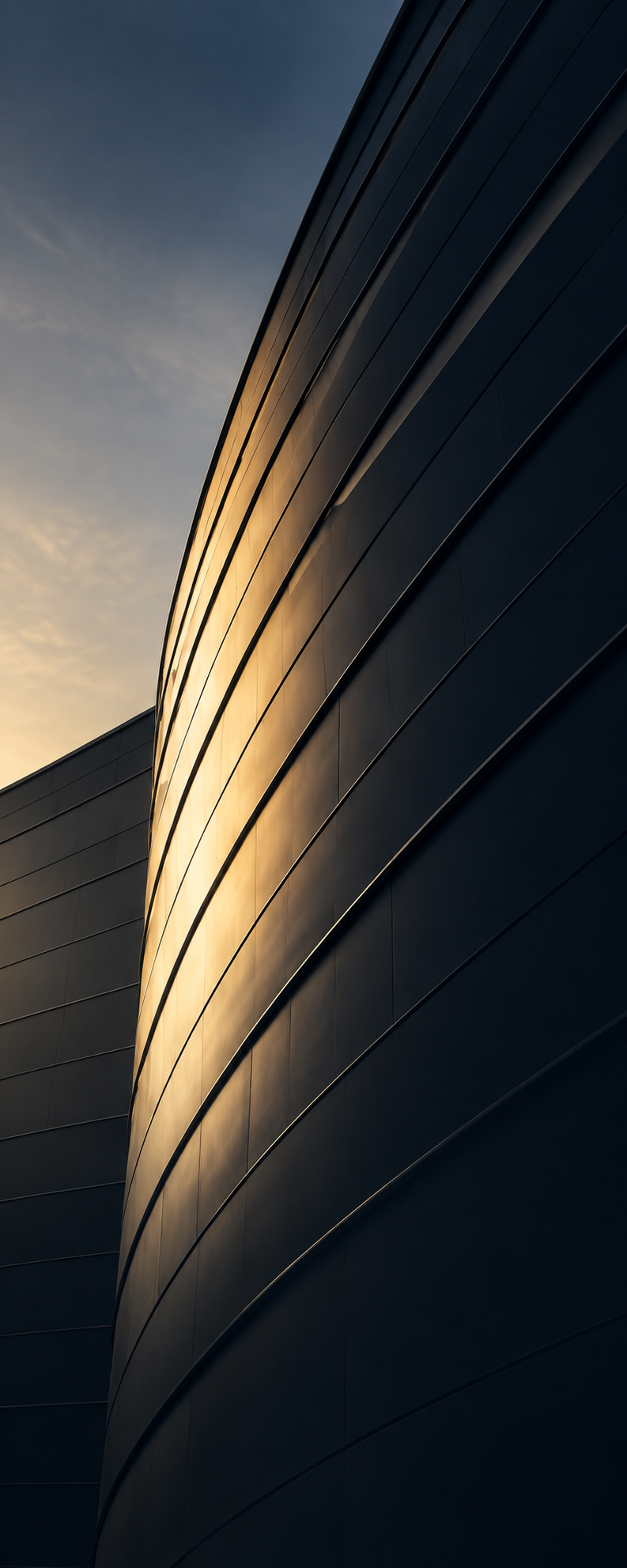 Modern architectural facade illuminated by warm evening light